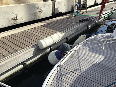 Dock fender with round buoy for stern protection